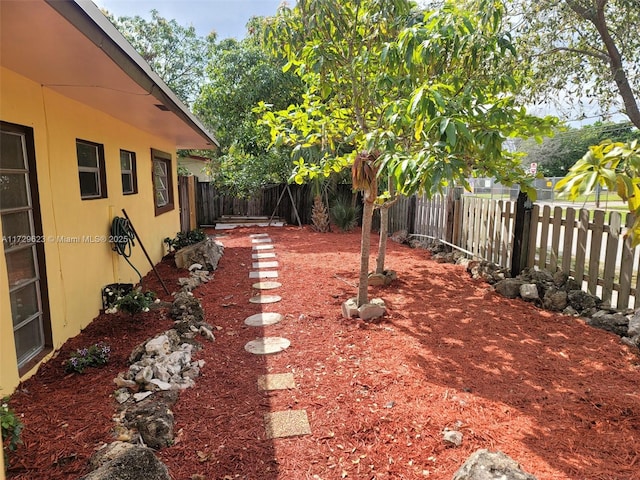 view of yard with a fenced backyard