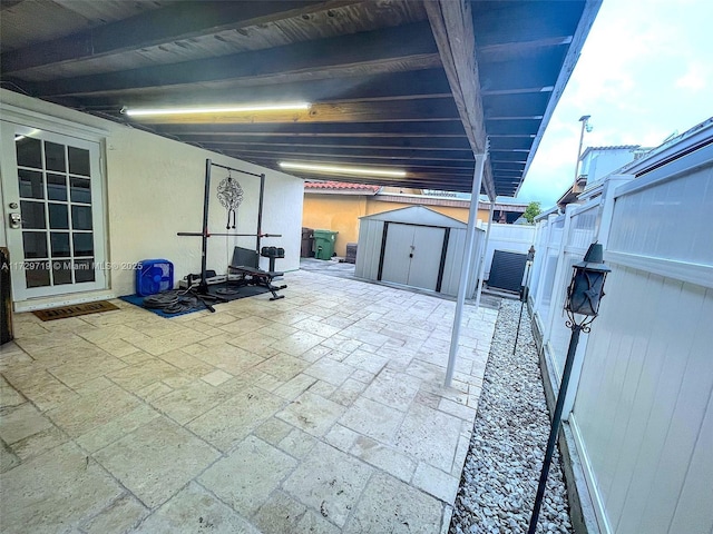 view of patio / terrace with a shed