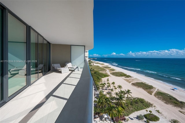 balcony with a view of the beach and a water view