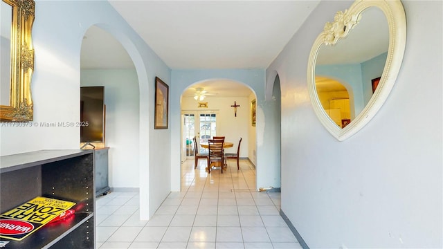 corridor featuring light tile patterned flooring