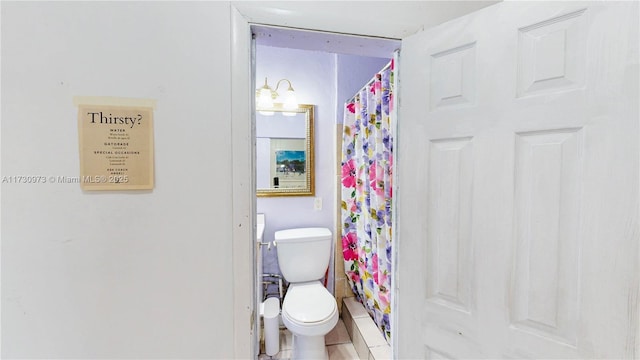 bathroom with walk in shower and toilet