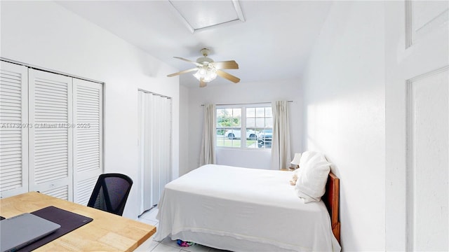 bedroom featuring light tile patterned flooring and ceiling fan