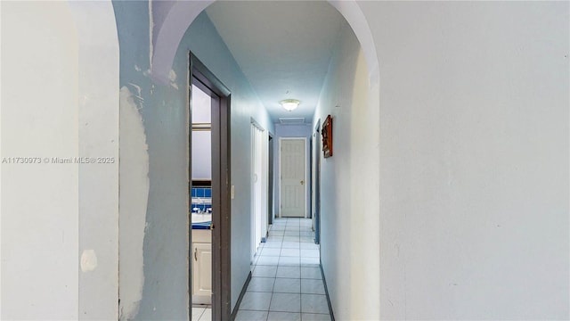 hallway with light tile patterned flooring