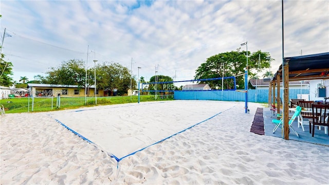 view of home's community featuring volleyball court