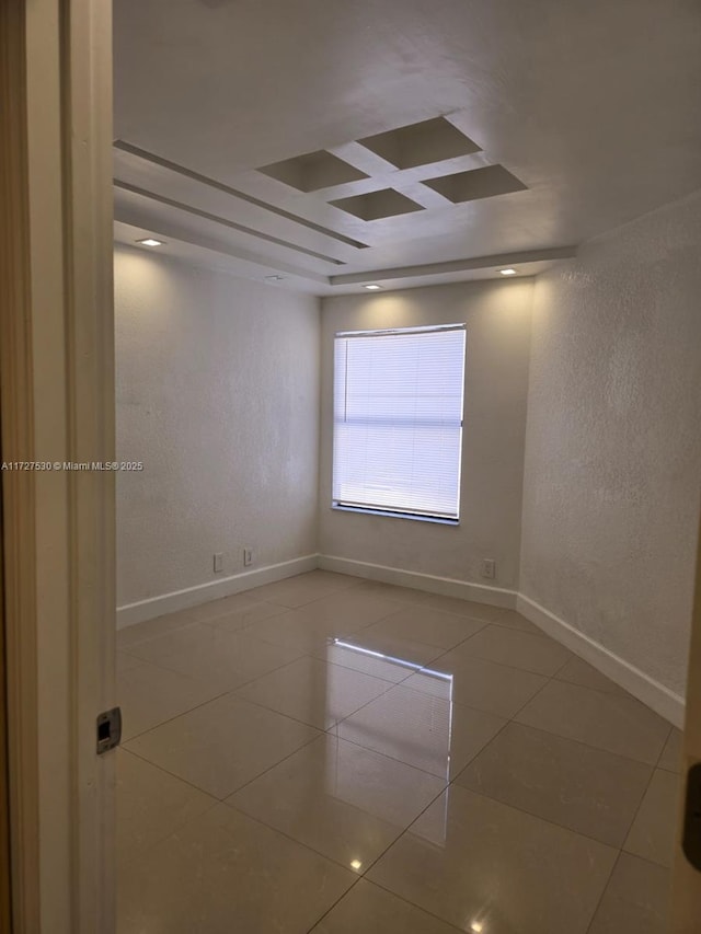 spare room with tile patterned flooring