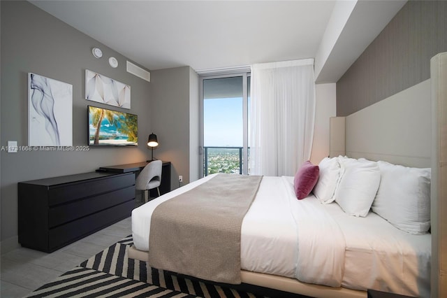 bedroom with floor to ceiling windows