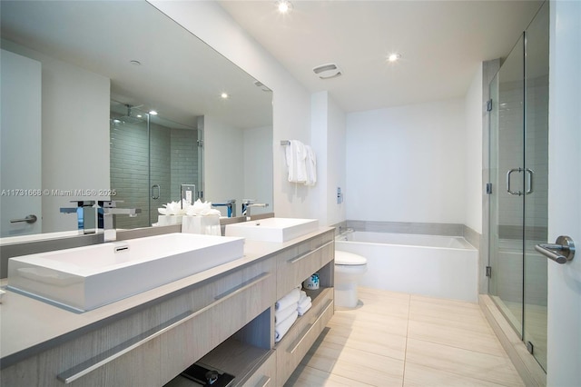 full bathroom featuring vanity, tile patterned flooring, independent shower and bath, and toilet