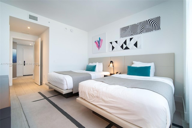 bedroom featuring light hardwood / wood-style floors