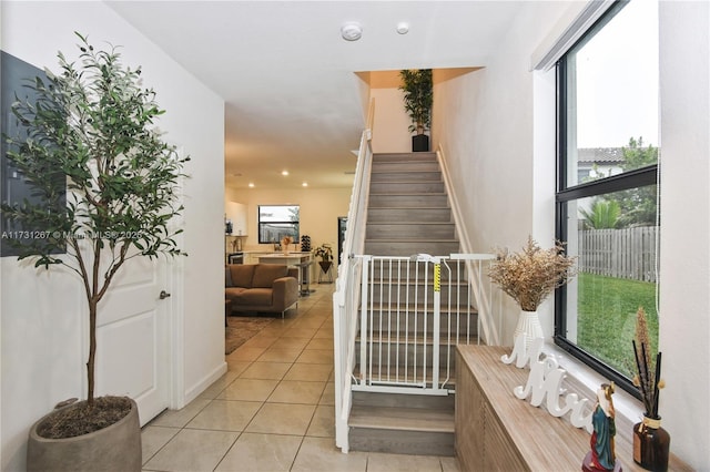 stairs with tile patterned floors