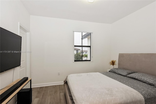 bedroom featuring dark hardwood / wood-style flooring