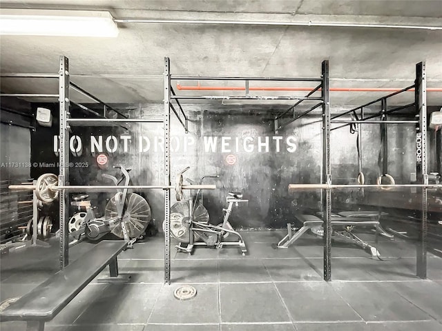 workout area with tile patterned floors