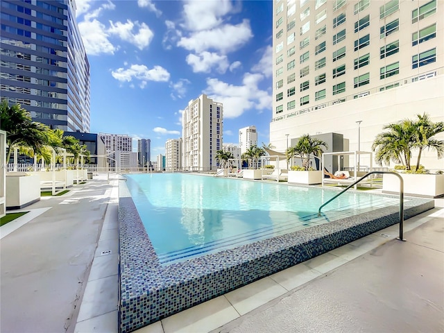 view of swimming pool with a patio area