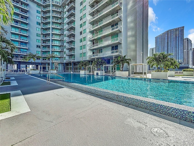 view of swimming pool with a patio