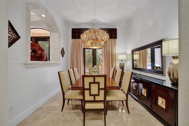 dining area with a notable chandelier and crown molding