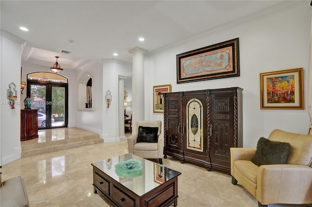 living room featuring ornamental molding, french doors, and ornate columns