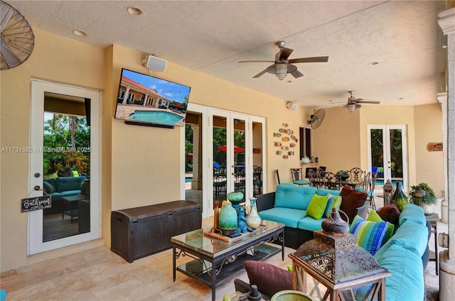 view of patio / terrace featuring outdoor lounge area, french doors, and ceiling fan