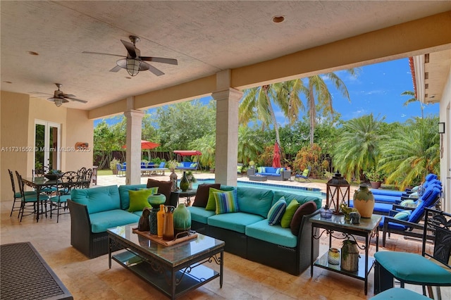 view of patio / terrace featuring a fenced in pool, outdoor dining area, ceiling fan, and an outdoor living space