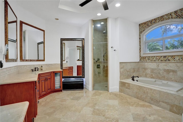 bathroom featuring vanity, decorative backsplash, independent shower and bath, and ceiling fan