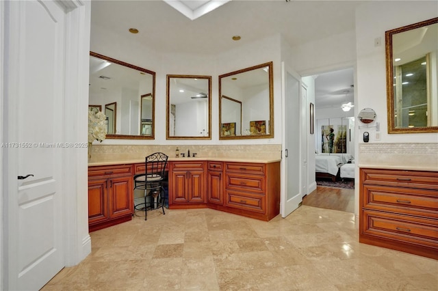 bathroom featuring tasteful backsplash and vanity