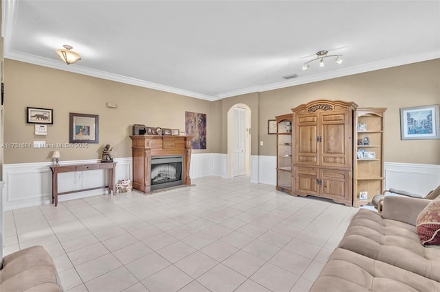 tiled living room featuring crown molding