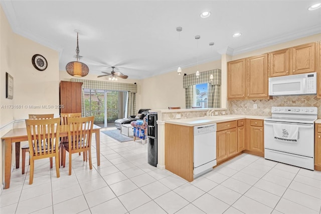 kitchen with pendant lighting, backsplash, light tile patterned floors, crown molding, and white appliances