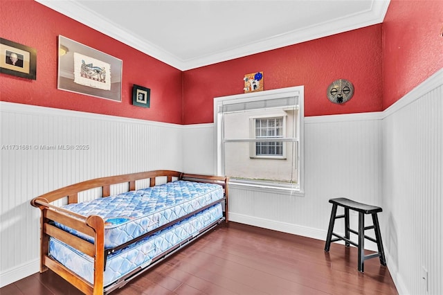 bedroom featuring crown molding and hardwood / wood-style floors