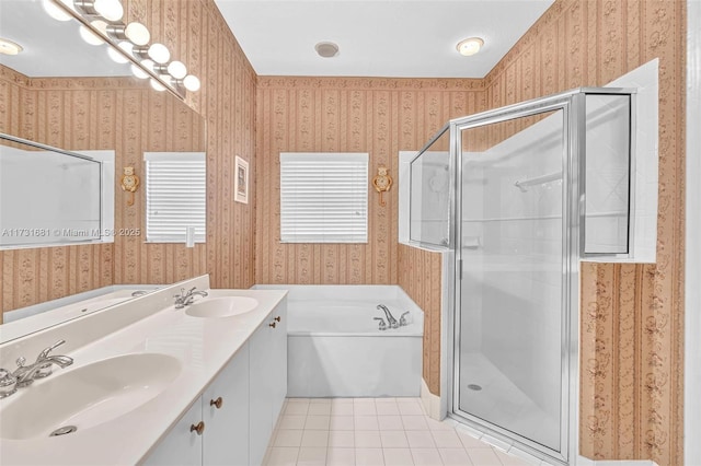 bathroom featuring tile patterned flooring, vanity, and plus walk in shower