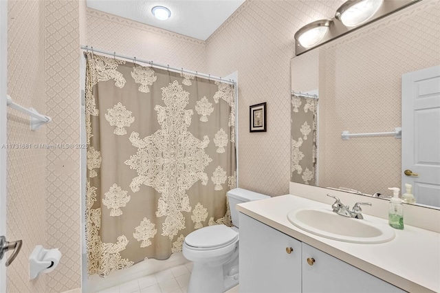 bathroom with tile patterned floors, vanity, and toilet