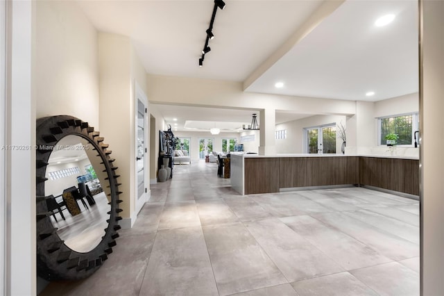 foyer with rail lighting and french doors