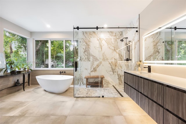 bathroom with vanity, independent shower and bath, and tile walls