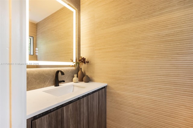 bathroom featuring tasteful backsplash and vanity