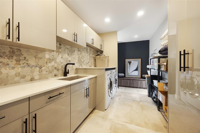 laundry area featuring washer and dryer and sink