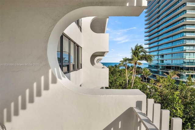 balcony featuring a water view