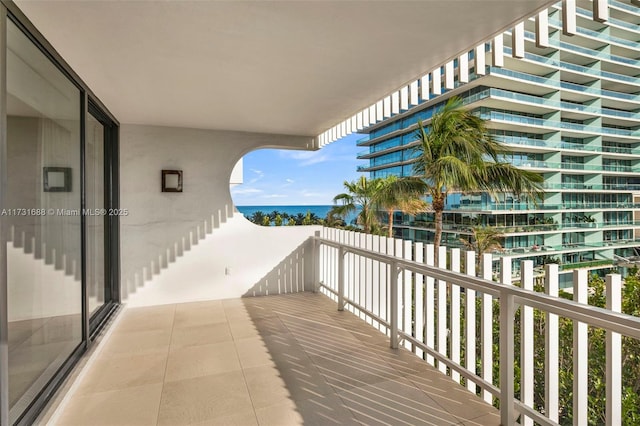 balcony featuring a water view