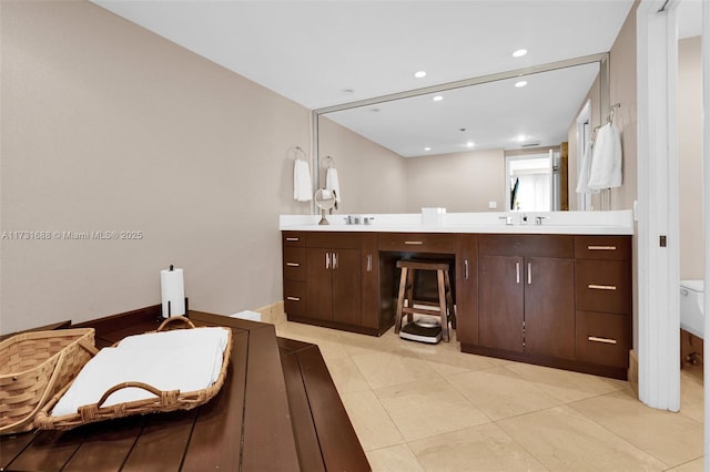 bathroom with vanity, tile patterned floors, and toilet