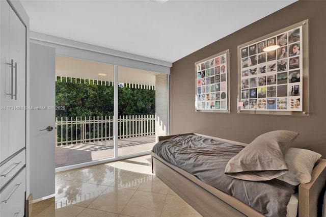 bedroom with floor to ceiling windows and access to outside