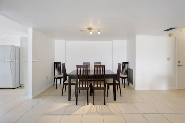 dining room with light tile patterned floors