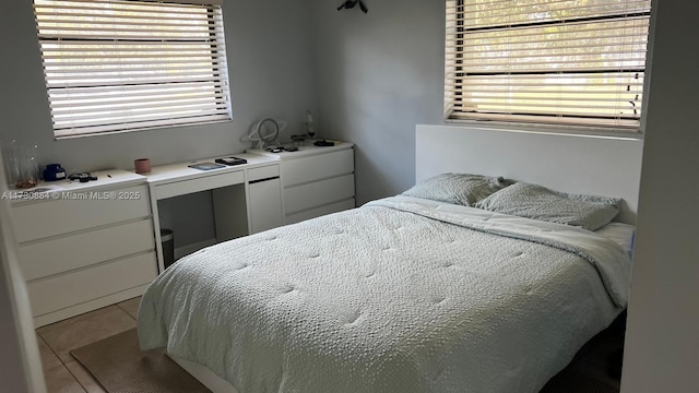 bedroom with light tile patterned flooring