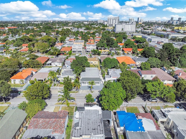 birds eye view of property with a view of city