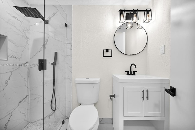 bathroom with a textured wall, vanity, a marble finish shower, and toilet