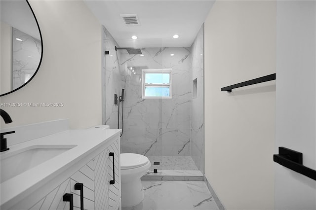 bathroom featuring a marble finish shower, marble finish floor, visible vents, and toilet