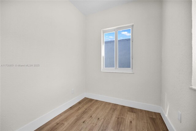 unfurnished room featuring light wood-type flooring