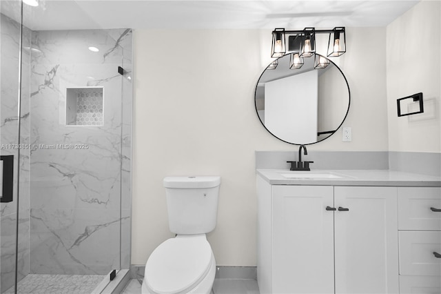 full bathroom featuring toilet, a marble finish shower, and vanity