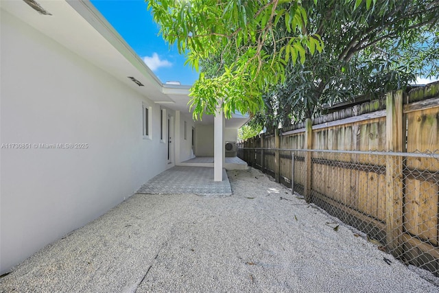 view of patio / terrace featuring fence