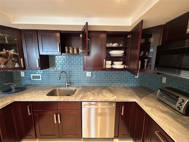 2030 S Ocean Dr Unit 506, Hallandale Beach, FL 33009 - kitchen with dishwasher, open shelves, tasteful backsplash, and light stone countertops