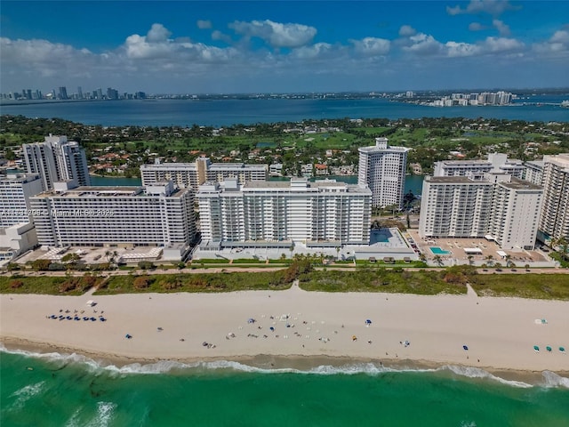 aerial view with a water view and a beach view