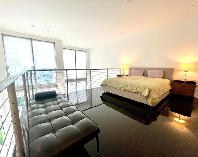 bedroom featuring expansive windows