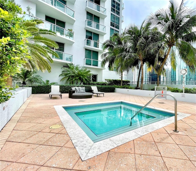 view of swimming pool with a patio area