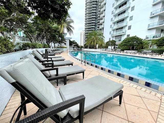 view of pool featuring a patio area