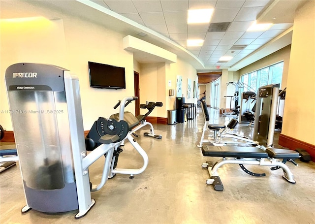 workout area featuring a paneled ceiling